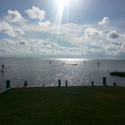 a group of clouds in the sky over a body of water