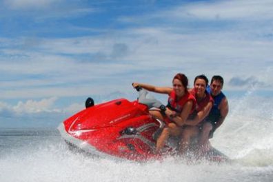 a man riding a wave on top of a body of water