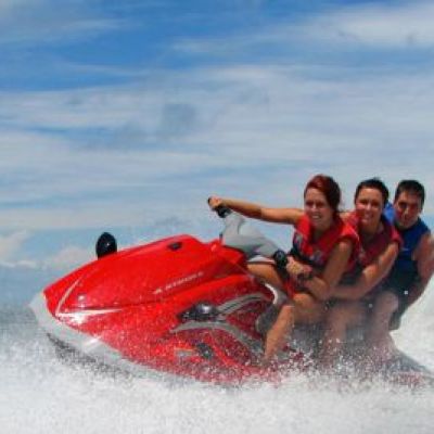 a man riding a wave on top of a body of water