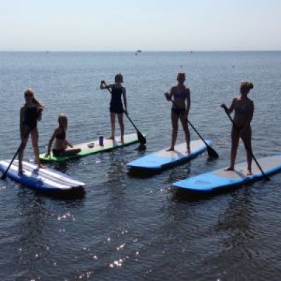 a group of people that are standing in the water